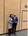 Dr. Joerg Christian Tonn receives the Synaptive Preuss Award at the CNS 2022 from Dr. Jennifer Moliterno, AANS/CNS Section on Tumors Awards Chair.